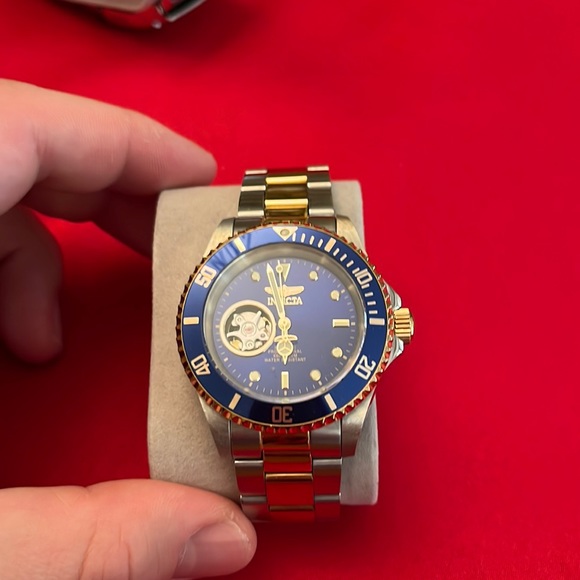 2. Invicta no tick- automatic move open back watch
